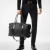 Bolso de viaje con hebilla lateral de piel lisa