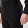 Pantalón bouclé ligero con lentejuelas Pantalón bouclé ligero con lentejuelas