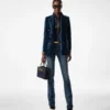 Pantalones acampanados de denim elástico sin tratar
